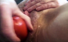 Cumslut fucks an aubergine